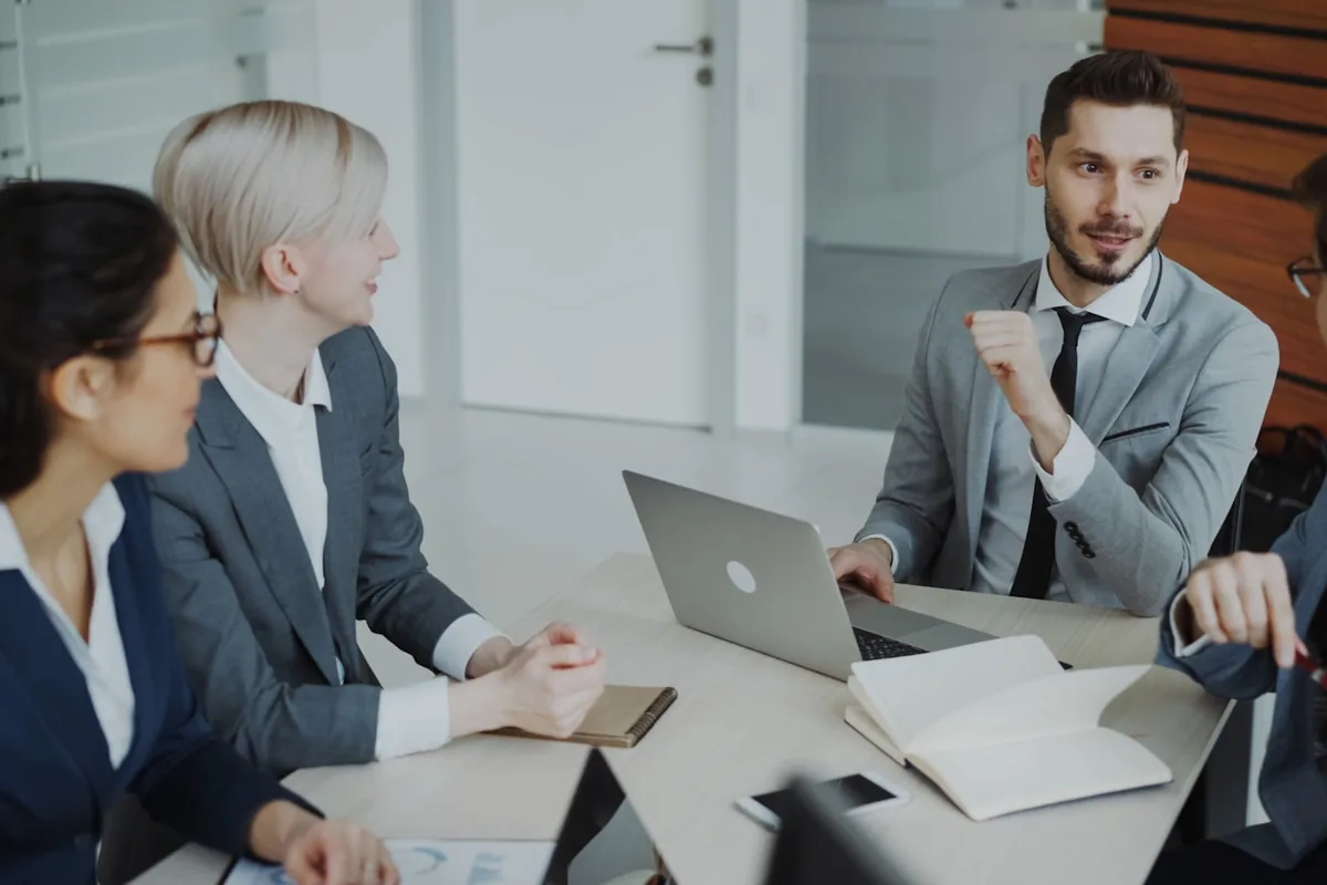 The Rule Seven marketing team working together in their office.