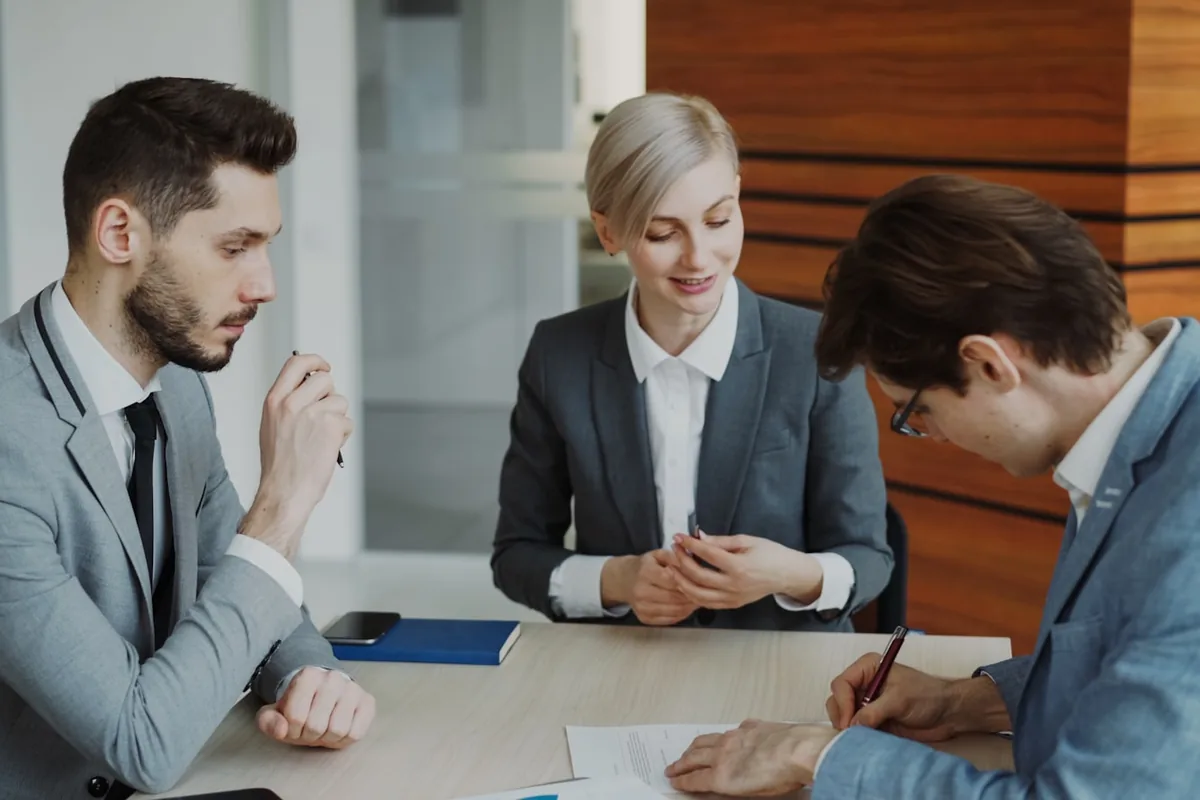 Two Rule Seven specialists planning a bilingual campaign for a law firm.