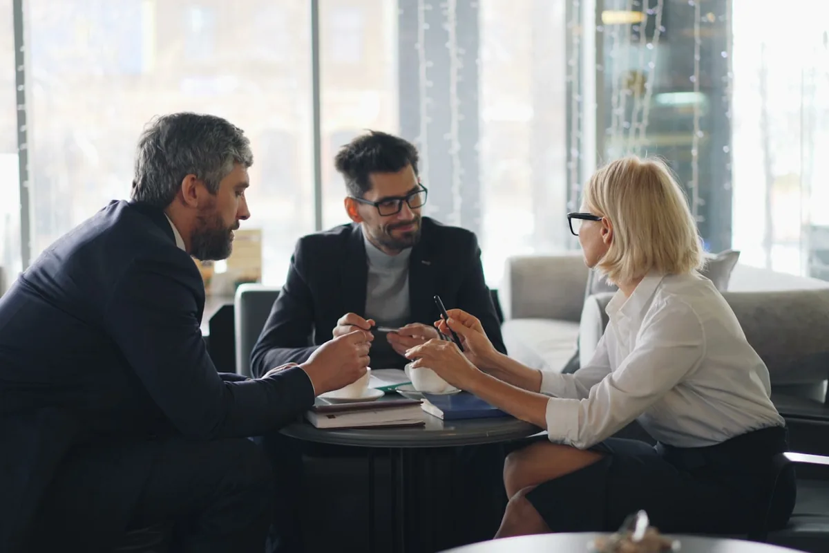 A marketing team comparing law-firm SEO approaches in a conference room.