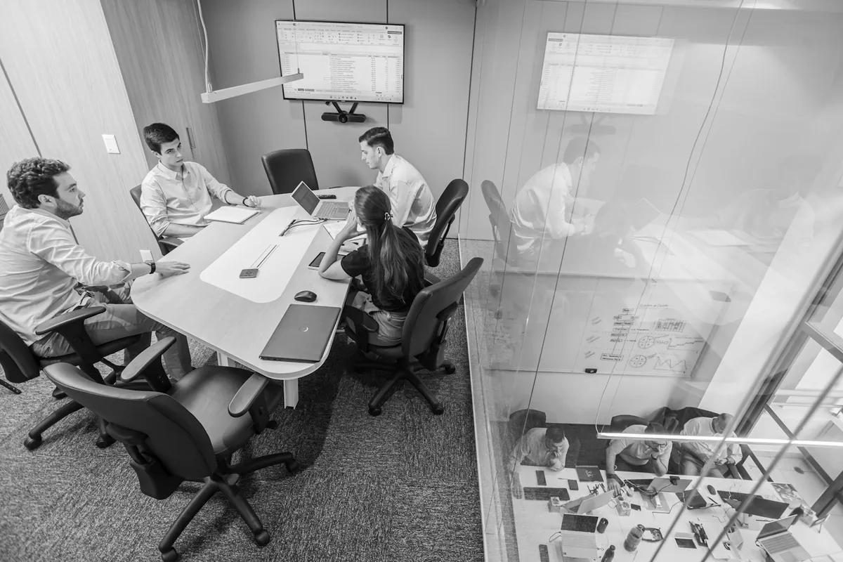 A law firm's leadership team weighing marketing-agency options in a boardroom.