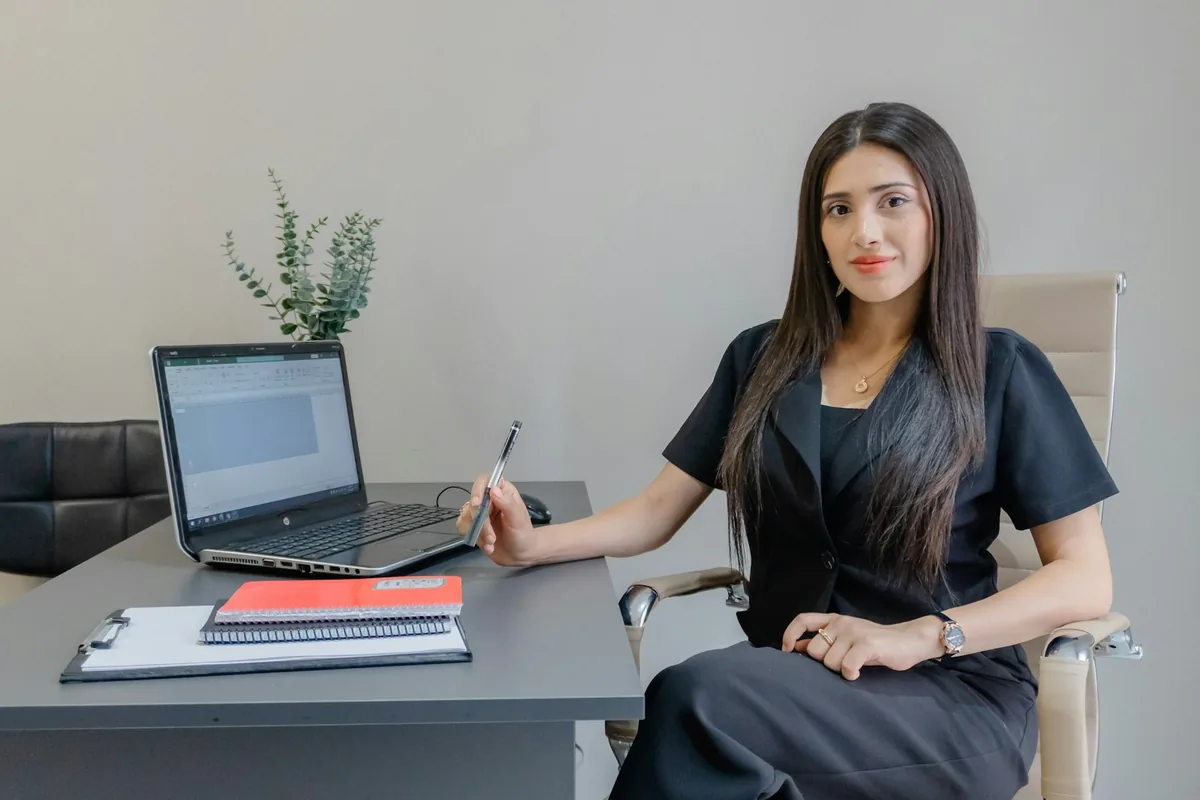 A marketing strategist at Rule Seven reviewing a client's campaign analytics on a laptop.