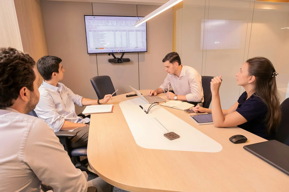 An employment-law team reviewing a marketing plan in a modern office.