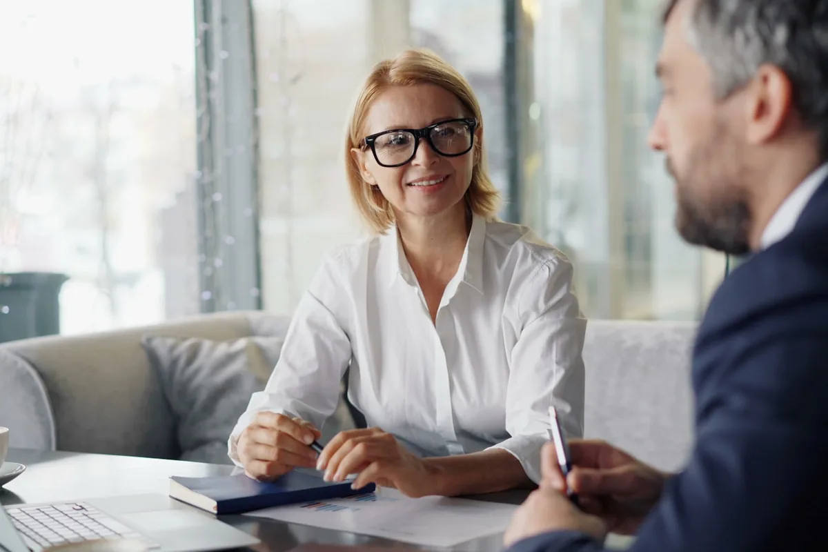 A couple reviewing estate-planning documents with an advisor.