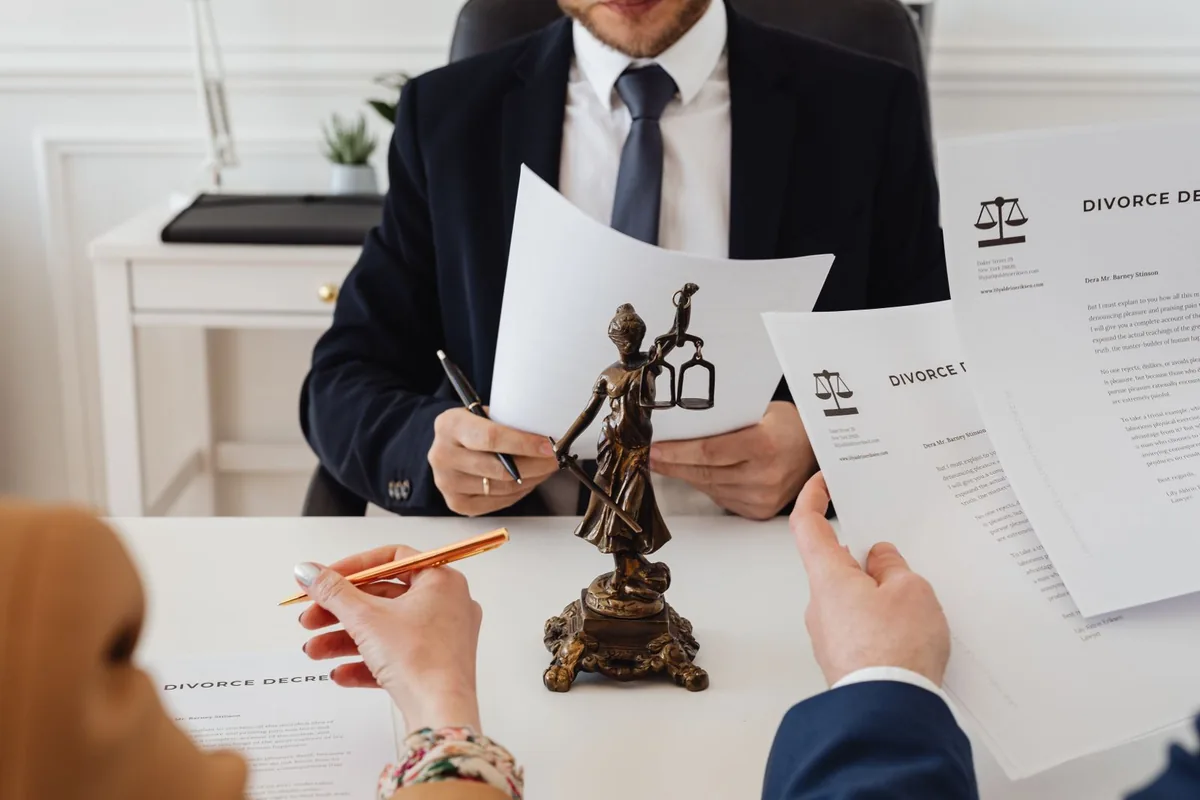 A family-law attorney meeting compassionately with a client.