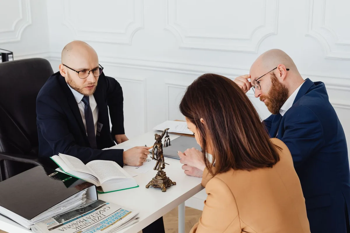 A personal-injury attorney meeting with an injured client and their family.