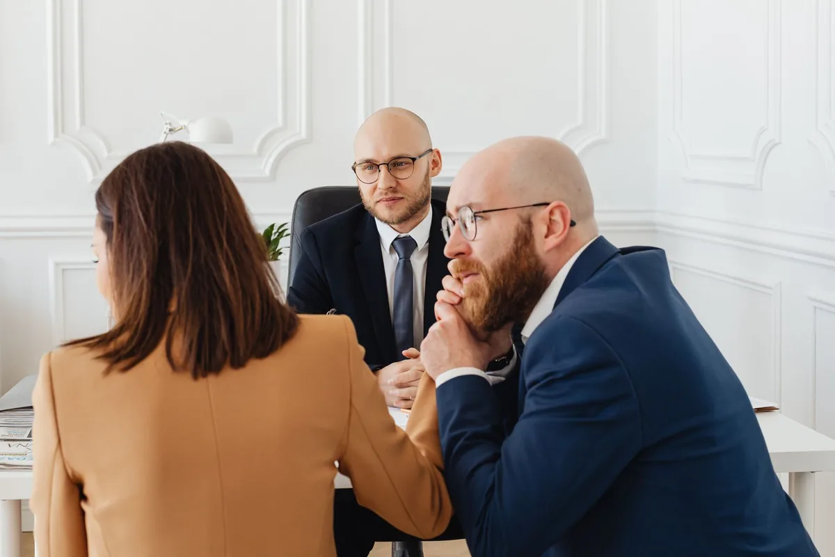 Two personal-injury attorneys reviewing case-intake results with a Rule Seven strategist.