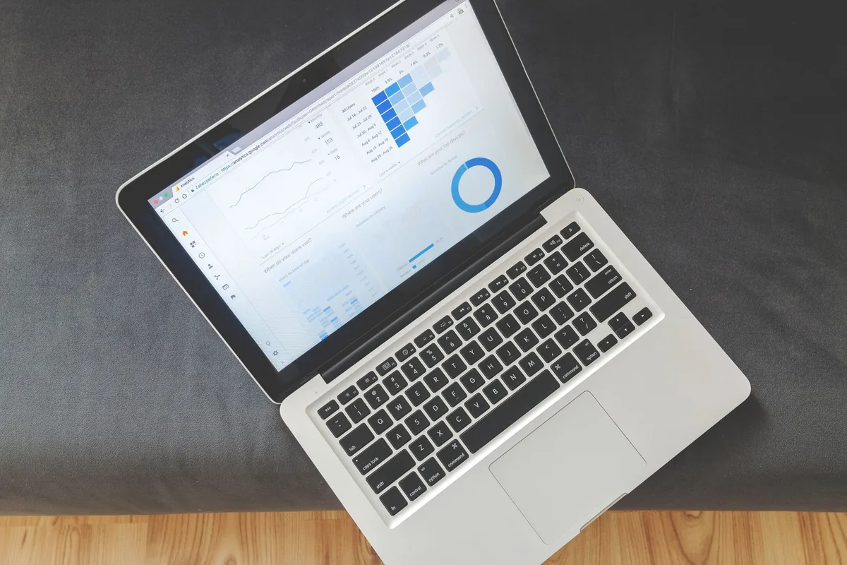 A laptop showing a paid-search advertising dashboard for a law firm.